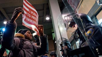 Tears and detention for US visitors as Trump travel ban hits