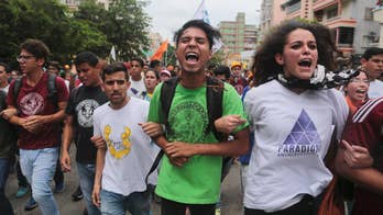 Hundreds evacuated in Venezuela as tear gas seeps into homes