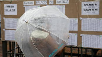 The Latest: Polls open for vote on Colombia peace deal