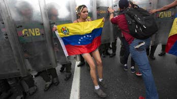 Venezuelans clash with police in march to demand recall