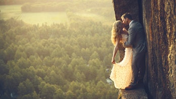 New Hampshire wedding photographers capture couples at stunning heights