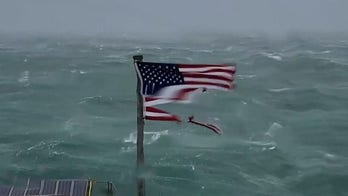 US flag seen shredded by Hurricane Florence being auctioned for Red Cross