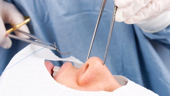 Doctors pulled a tooth out of a man's … what?