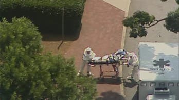 Second American diagnosed with Ebola arrives in Atlanta, showing 'slow improvement'