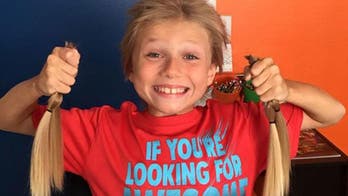 Boy endures teasing to grow hair 40 inches long for charity