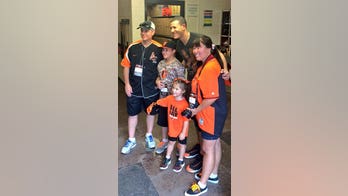 Robotic hand helps girl with birth defect throw first pitch at Orioles game