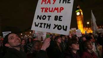 Amid protests, UK lawmakers debate downgrading Trump visit