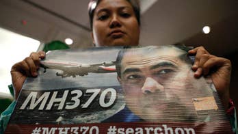 Officials to decide whether to extend search for Flight 370
