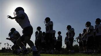 In summer heat, athletic trainers call for safety measures