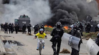 Striking truckers clash with police in Colombia's capital