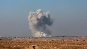 Iraqi forces push into Mosul's main military base by airport