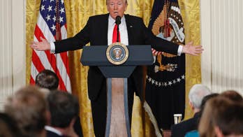 Trump supporters cheer his combative stance with the media