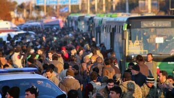 The Latest: Aleppo evacuations set to begin again