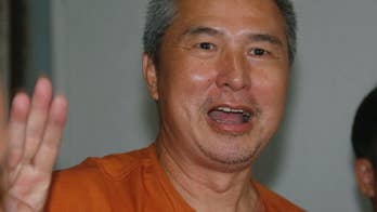 Thai editor has lese majeste jail sentence reduced