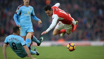Late Sanchez penalty gives Arsenal 2-1 win over Burnley
