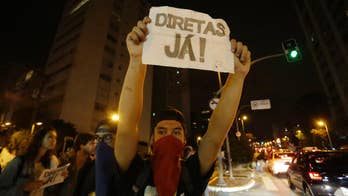 Brazilian police clash with protesters rejecting new leader