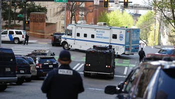 The Latest: Arrest made after 2 officers shot in Seattle