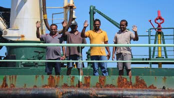 Ship hijacked and then freed by Somali pirates, at safe port