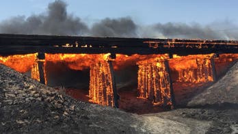 The Latest: Firefighters struggle to control wildfires