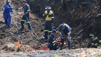 South African rescuers look for boy who fell into mine shaft