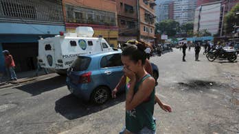 Venezuela president heckled as protests spread to slums