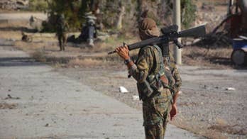 Syrian Kurdish forces to push on IS capital this summer