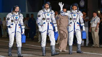 American astronaut, two others back on Earth after 115 days in space
