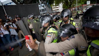 Venezuelan protesters clash with police, demand recall