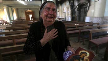 Gasps, tears as Iraqis return to IS-destroyed parish