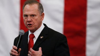 Roy Moore accuser sues him for defamation after attacks