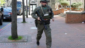 Police: 2 officers shot responding to robbery in Seattle