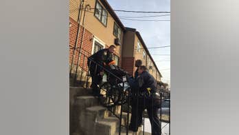 NYPD officers help wheelchair-bound veteran, 85, left shivering in front of steps