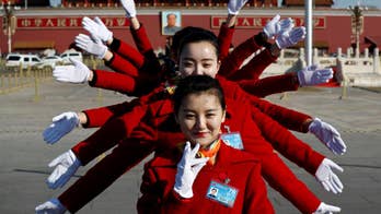 Eyes on selfie-taking ushers at China's political meetings