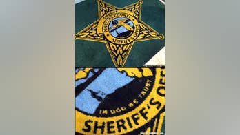 'In Dog We Trust' accidentally printed on rugs at a Florida Sheriff's Office headquarters