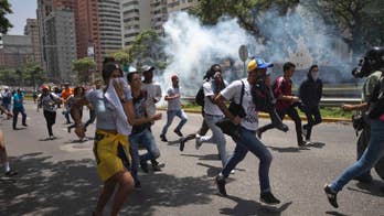 Police fire pepper spray at opposition march in Venezuela