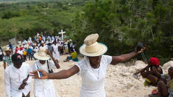 AP PHOTOS: Haitians make pilgrimage, pray for better future