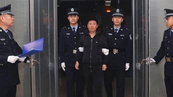 China says fugitive businessman returns after 15 years