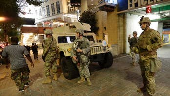 The Latest: Police detail charges against 5 protesters