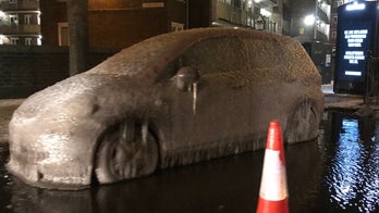 Car found frozen in ice  during London's historic cold snap