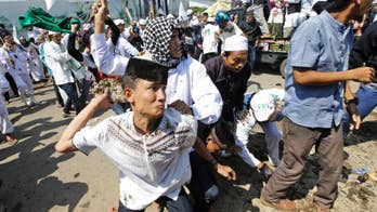 Indonesia police fire tear gas on Muslims protesting church