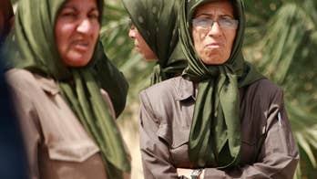 Final group of Iranian dissidents leaves Iraq camp
