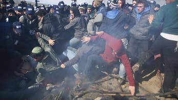 Israeli forces nearly finished evacuating West Bank outpost