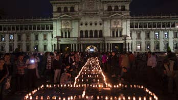 Guatemalan president vows change after fire kills 35 girls