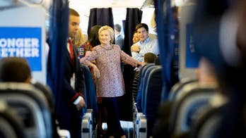 Clinton returns to campaign, smiling and appearing energetic