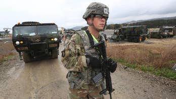 North Korea decries US carrier dispatch as parliament meets