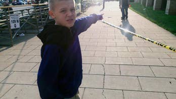 The Latest: 2 being questioned in shooting near Derby parade