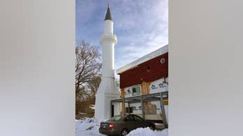 Construction halted on mosque with too-tall minarets