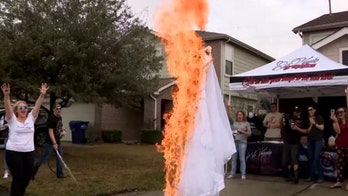 Domestic violence survivor torches wedding dress at garage sale