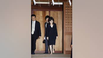 Japan's defense minister visits controversial shrine after Pearl Harbor