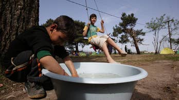 The Latest: Turkey: Border guards didn't shoot at Syrians